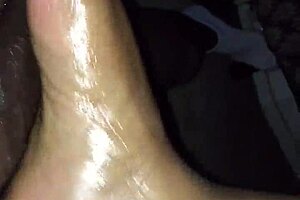 Ebony gets footjob before exploding on her pretty feet