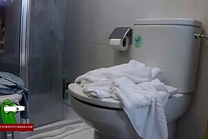 Mature amateur on top of the toilet masturbating cum