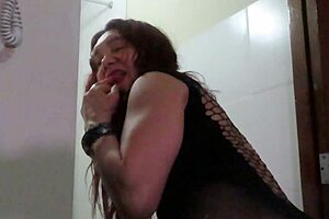 Super hot milf goes crossdressing and plays with her breast and wet nipples before showing her juicy twat