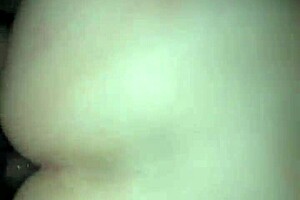 Small blonde Brazilian prostitute giving a swirling blow job in a sparsely furnished hotel room