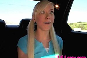 Teen blonde Little Lexy fakes masturbation while sitting in the back seat of a car