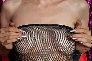European Goddess in fishnet lingerie naked with natural tits and small boobs