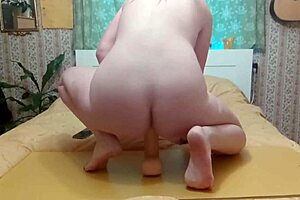 This big titted blonde is not ashamed to take a huge dildo with her in a creative scene