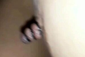 Home video of man and woman from the privacy of their bedroom performing nipple torture and BDSM