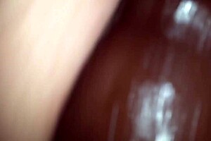 Busty babe strips and fondles her b00bs while using a big black sex toy