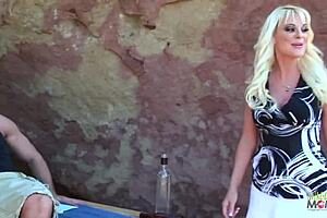 A blonde with large brests [sic] is the lucky guy whom a trololo rides by the rocks and gives a facial