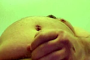 Masturbating on a tabletop on the floor in a hotel room
