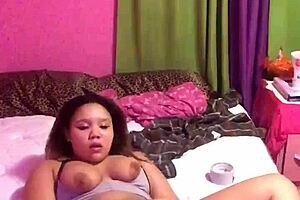 African American woman using vibrator to pleasure herself