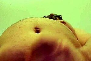 Masturbating on a tabletop on the floor in a hotel room