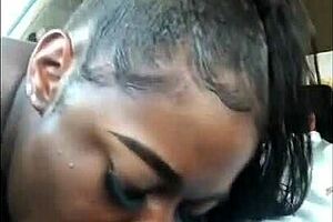 A beautiful ebony girl takes public oral sex on a parking lot