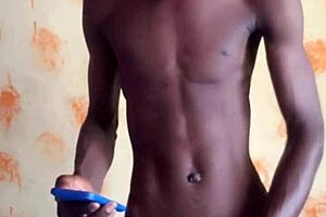 This hottie Mandingo oiled up his body and his big dick before he masturbates