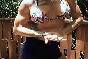 Strong man shows muscles in the forest