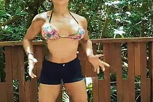 Strong man shows muscles in the forest