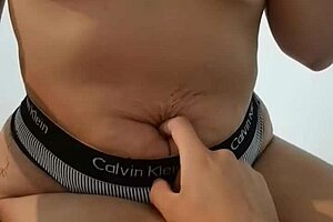 I pleasure her while she plays with my belly button