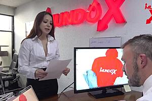 The boss tells her that she will be fired but satisfies him with a blowjob