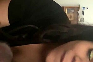 A young girl takes a man's huge black cock and swallows him cum