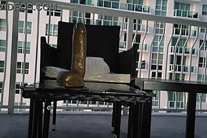 A beautiful lady with light skin tone pleasure’s herself with a fake dick on her balcony and she gives a hot shower with her wet cumshots