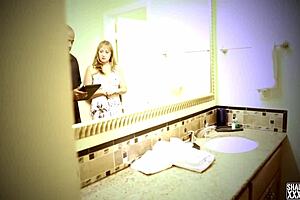 A very busty amateur is showered with cum