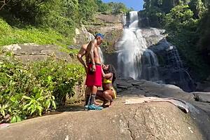 Pretinha 18 outdoor scene in a crude manner in the video surrounded by a waterfall