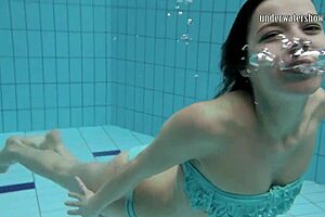 Gazel disrobes underwater, in her seductive pose