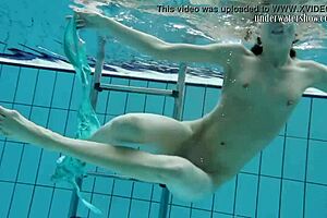 Gazel disrobes underwater, in her seductive pose