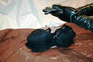 Deprived of nothing; a sensual massage of a dolls breasts and body, climaxing in merciless pussy fingering with black latex gloves