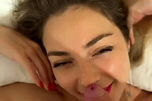 An incredibly stunning girl plays with a huge cock with natural tits