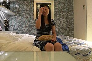 Asian teen athlete giving oral pleasure to a stunning Asian teen
