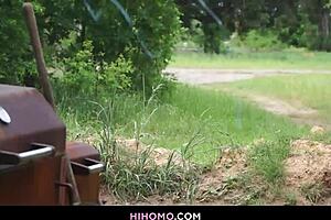 Black and white gay men engage in anal sex in the open
