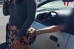A middle aged woman has her husband to record her while she pleases herself in a car with a stranger.