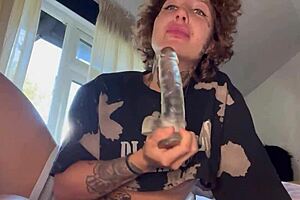 A girl with tattoos gives rough blow job until she cries and then sucks a dildo.