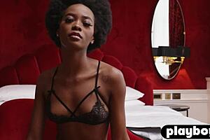Alicia, a beautiful black teen model, wears elegant black lingerie.