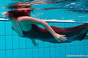 Nata Szilva is a brunette beauty who enjoys swimming in the pool.