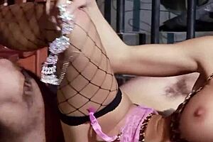 A sexy blonde police officer has some fun with a bad guy in her custody.