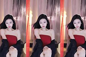 Beautiful Asian girl dancing in transparent dress and big boobs