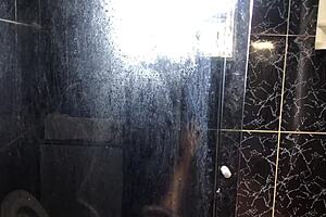 Young guy has sex with his friend’s aunt in the bathroom of her white house.