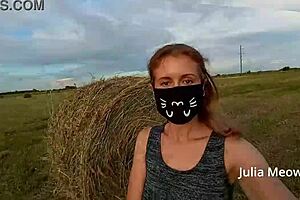 Juli Smith undresses in a public field