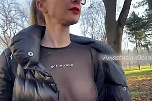 Beautiful woman showing her big boobs in a public park