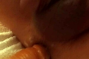 A girl uses a dildo to have sex with a man in the anus