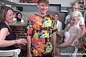 A family has a group sex with their virgin son in a bar