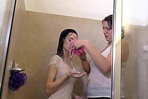 Steamy scene with big-boobed and small-boobed lesbians in the bathtub