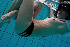 A sexy and petite European teen strips quickly to reveal her beautiful body