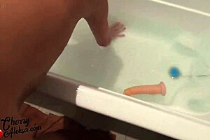 A mature woman has a hardcore sexual experience with a big cock and a dildo in the bathroom