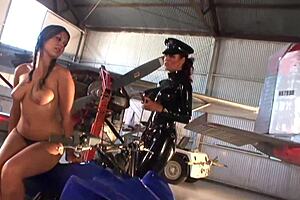Lesbians have fun with strapon in warehouse adventure