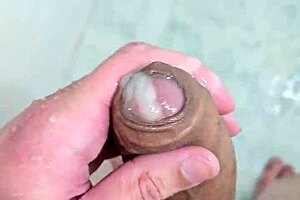 Solo beauty takes a bath with cum on her body