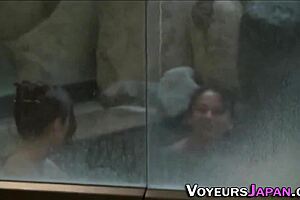 Naked shower of Asian cuties outdoors