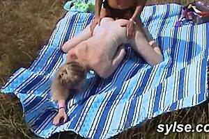 Young European women have lesbian sex next to a road