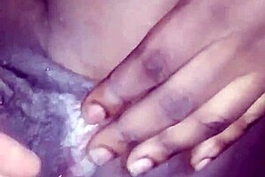 Fingerin' an ebony teen's pussy and it's open wide in this high quality video