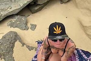 Alternative blonde gets some African dick in her ass on the beach