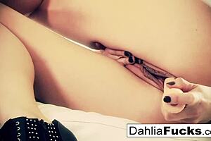 Dahlia is a sexy pornstar who uses a dildo to pleasure herself
